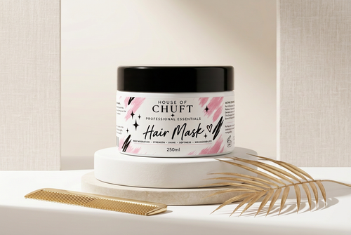 Editorial image of the House of Chuft Hair Mask with a gold brush replacing the pen